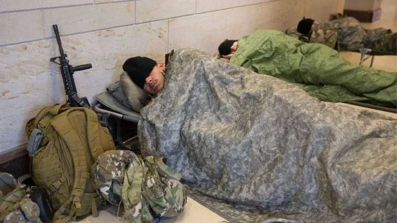 Biden apologises over troops sleeping in car park
