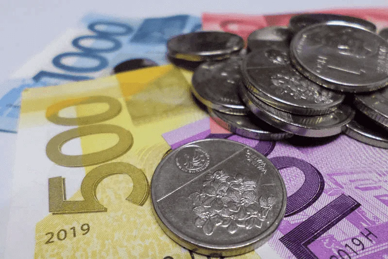 Easy policy lays out a hard road for underperforming peso, baht