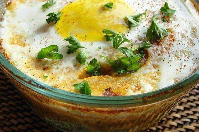 c-4303-bae4-8db17061d89a--baked_eggs_over_couscous.webp