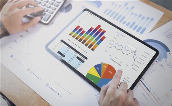 businesswoman-using-tablet-analysis-graph-company-finance-strategy-statistics-success-concept-...jpg