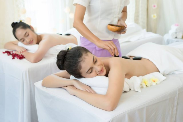 young-beautiful-woman-getting-hot-stone-spa-treatment-1.jpg