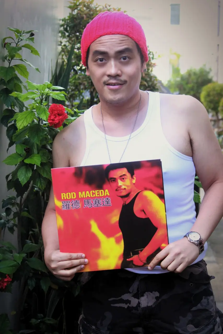 Rod Maceda holding his vinyl album cool smirk.webp