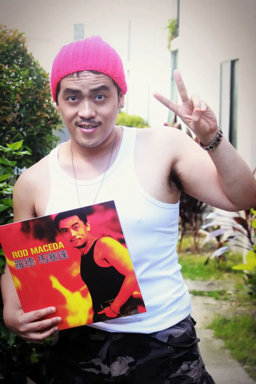 Rod Maceda holding his vinyl LP Album peace sign.webp
