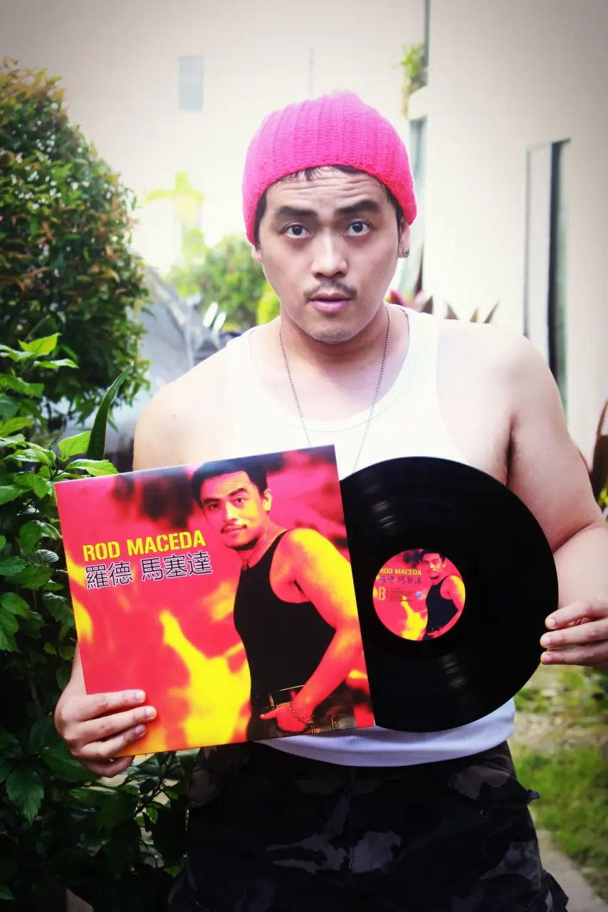Rod Maceda holding his vinyl wearing white sando.webp